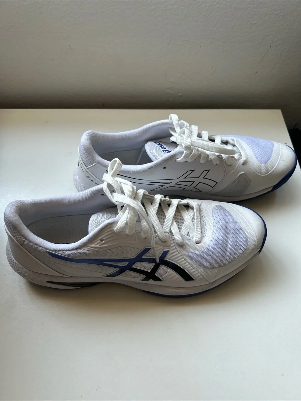 ASICS White Athletic Running Shoes with Blue and Black Accents
